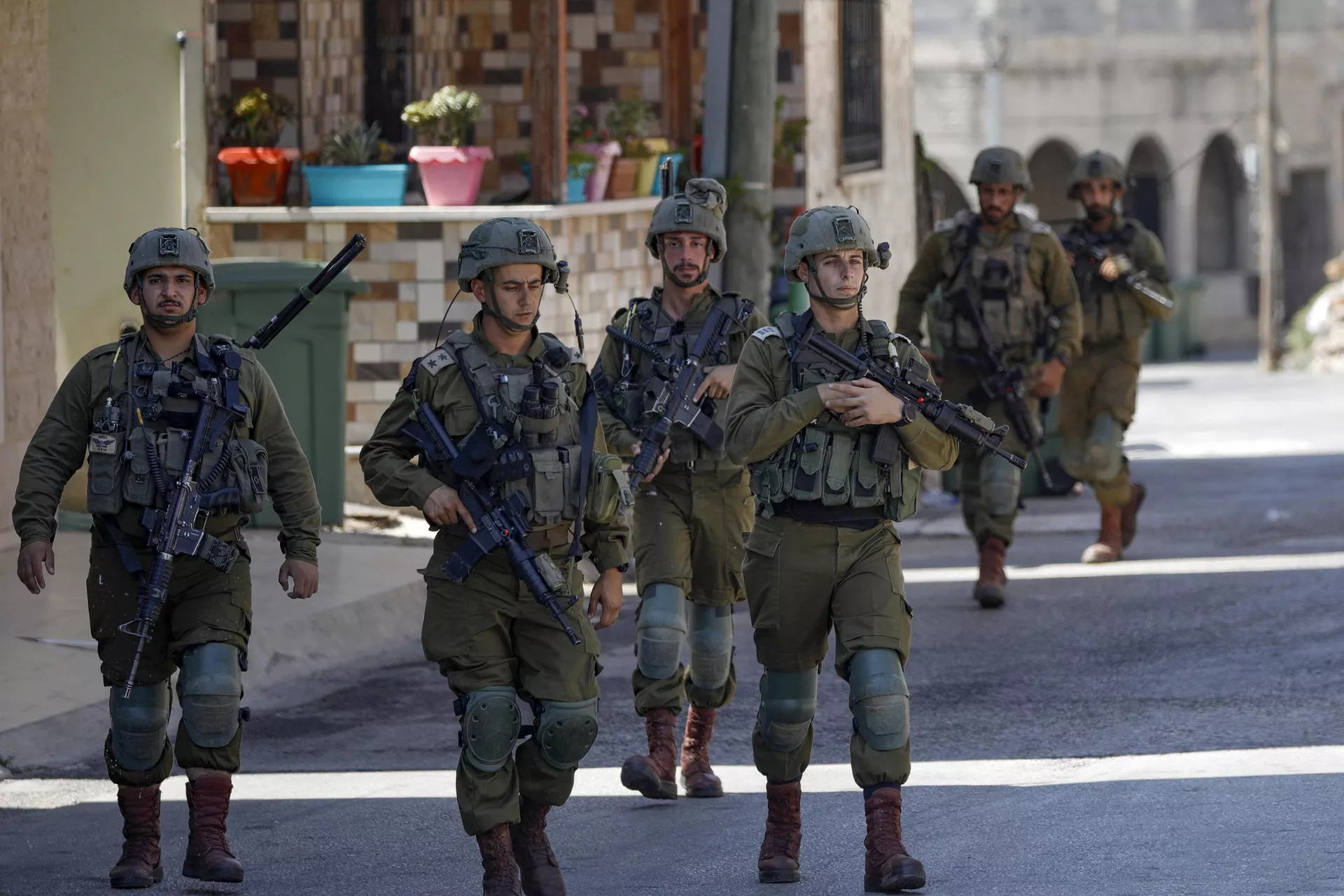 Israeli soldiers patrol the town of Ghajar in the occupied Golan Heights bordering Lebanon on July 6, 2023. - Sputnik International, 1920, 10.10.2023