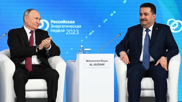 Russian President Vladimir Putin and Iraqi Prime Minister Mohammed Al Sudani at the plenary session of the Russian Energy Week - Sputnik International