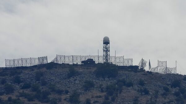 The fence of an Israeli military position is seen damaged after Hezbollah targeted it by rockets, on an occupied hill of Kfar Chouba village, southeast Lebanon - Sputnik International