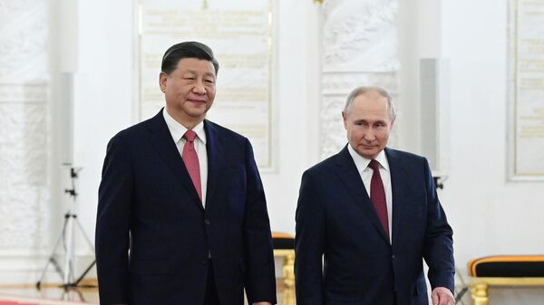 Russian President Vladimir Putin's meeting with Chinese counterpart Xi Jinping in Moscow. File photo - Sputnik International