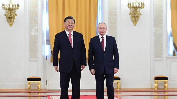 Russian President Vladimir Putin's meeting with Chinese counterpart Xi Jinping in Moscow. File photo - Sputnik International