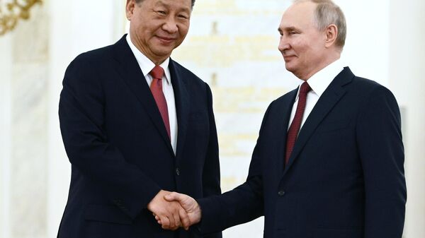 Russian President Vladimir Putin's meeting with Chinese counterpart Xi Jinping in Moscow. File photo - Sputnik International