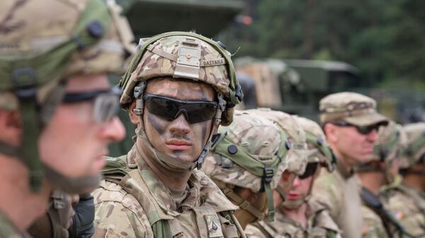 American soldiers are seen during NATO Saber Strike military exercises on June 16, 2017 in Orzysz, Poland. - Sputnik International