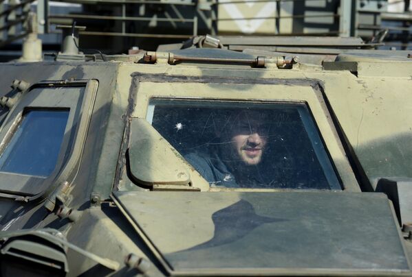 A visitor explores the insides of a Ukrainian infantry fighting vehicle (IFV). - Sputnik International