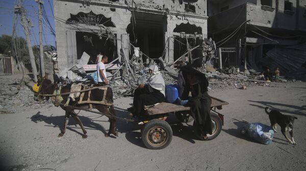 Gazans flee from their homes after Israeli airstrikes on the Rafah refugee camp.
 - Sputnik International