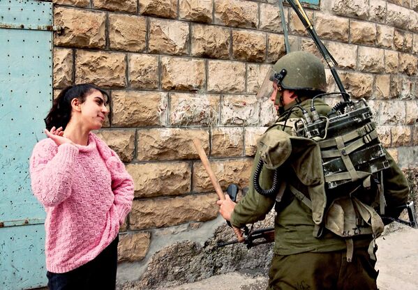 A Palestinian girl talks to an Israeli soldier on February 28, 1988, in Bet Sahur after the Israeli army had entered the village near Bethlehem following violent demonstration.The Palestinian uprising, often referred to as the intifada, was a sustained period of Palestinian protests and resistance against Israeli occupation in the West Bank, Gaza Strip, and East Jerusalem. It began in December 1987 and continued until 1993 when the Oslo peace accords were signed.The intifada was sparked by a combination of factors, including frustration with Israeli occupation, economic hardship, political grievances, and a desire for self-determination. The intifada was characterized by a variety of forms of protest and resistance, including mass demonstrations, strikes, civil disobedience, and the use of stones as weapons. The term &quot;war of stones&quot; refers to the practice of Palestinian youths throwing stones at Israeli soldiers and military vehicles.It was not uncommon during the intifada for Israeli forces to enter Palestinian towns and villages, like Bet Sahur, in response to protests, often resulting in clashes.The intifada lasted for several years, during which time it had a profound impact on the Palestine-Israel conflict. It led to significant changes in the political landscape and eventually contributed to the initiation of peace talks.The intifada continued until 1993 when the Oslo peace accords were signed between Israel and the PLO, and laid the groundwork for subsequent negotiations. - Sputnik International