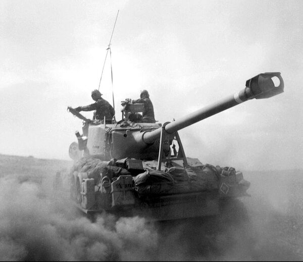 A US-built Israeli tank churns dust in the desert in this photo taken in June 1967 on the Golan Heights. Thirty years after the six-day war, new revelations show that Israeli generals exerted considerable pressure to push their government to go into battle. The war was decided on during a meeting 02 June 1967 between the chief of staff and the Labor government of Levy Eshkol following the failure of diplomatic negotiations. - Sputnik International