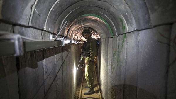 FILE - In this Friday, July 25, 2014 file photo, an Israeli army officer gives journalists a tour of a tunnel allegedly used by Palestinian militants for cross-border attacks, at the Israel-Gaza Border. - Sputnik International
