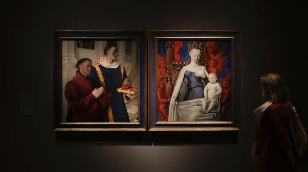 A woman inspects “The Melun Diptych” from the collegiate church of Melun by French painter Jean Fouquet from the 15th century displayed at the Gemaeldegalerie during a media presentation in Berlin, Thursday, Sept. 14, 2017. The exhibition brings the two fragments for the first time together since 80 years.The left panel came into the Gemaeldegalerie in 1896 and the right panel belonged to the Royal Museum of fine arts in Antwerp. The exhibition about the painter Jean Fouquet runs from Sept. 16, 2017 until Jan. 7, 2018. - Sputnik International