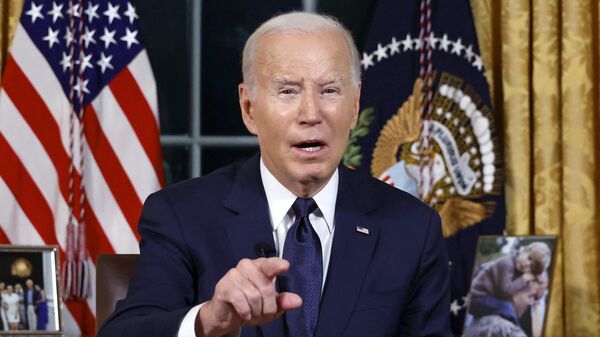 US President Joe Biden addresses the nation on the conflict between Israel and Gaza and the conflagration in Ukraine from the Oval Office of the White House in Washington, DC, on October 19, 2023. - Sputnik International