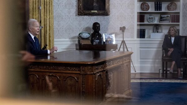 First lady Jill Biden, right, watches as President Joe Biden speaks from the Oval Office of the White House, Thursday, Oct. 19, 2023, in Washington. - Sputnik International
