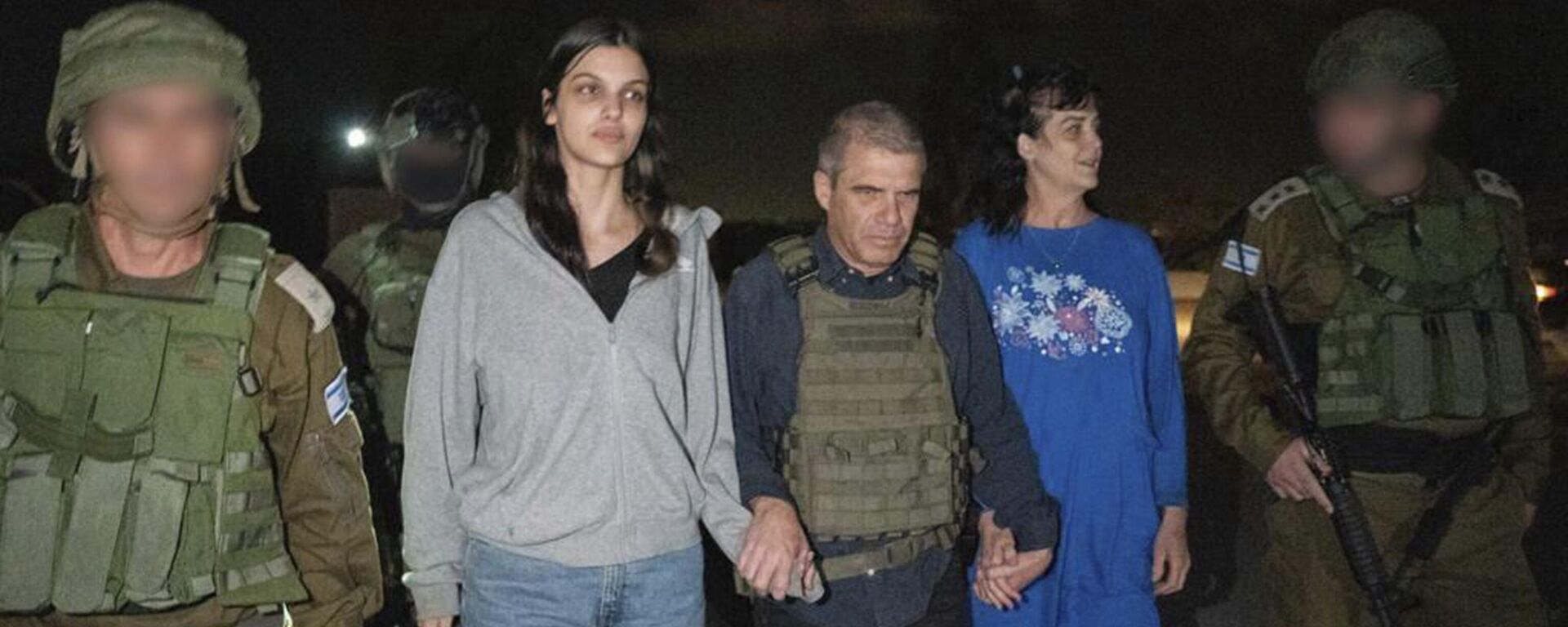 In this photo provided by the Government of Israel, Judith Raanan, right, and her 17-year-old daughter Natalie are escorted by Israeli soldiers and Gal Hirsch, Prime Minister Benjamin Netanyahu's special coordinator for returning the hostages, as they return to Israel from captivity in the Gaza Strip, Friday, Oct. 20, 2023. Hamas released the pair in what it said was a goodwill gesture late Friday, nearly two weeks after they were captured in a bloody cross-border raid by the Islamic militant group. The Hamas attack sparked a war that is entering its third week, and Hamas is believed to still be holding some 200 people hostage. - Sputnik International, 1920, 21.10.2023