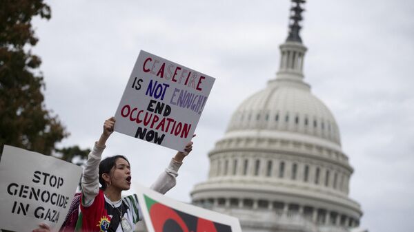 Members of the US Jewish community protest against the Israeli military operation in Gaza ousside the Cannon Senate office building on Capitol Hill in Washington, DC on October 18, 2023.  - Sputnik International