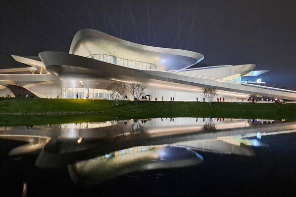 This photo shows people walking outside the Chengdu Science Fiction Museum, designed by Zaha Hadid Architects, during WorldCon. Once banned, Chinese science fiction has exploded into the mainstream, embraced by the government and public alike – inviting scrutiny of a genre that has become known for its freedom of expression. - Sputnik International