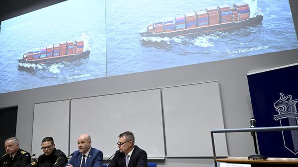 The commanding officer of the Finnish Navy Toni Joutsia (L to R), lieutenant commander of the Finnish Border Guard Markus Paljakka, the detective inspector of the National Bureau of Investigation Risto Lohi and the Chief of National Bureau of Investigation Robin Lardot attend a joint press conference of the investigation of the possible attack on the Balticconnector gas line on October 8, 2023. The screen shows Finnish Border Guard's photo of a Hong Kong-registered cargo ship Newnew Polar Bear, which was spotted moving close to the Balticconnector gas line.  - Sputnik International