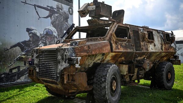 This photograph taken on August 15, 2023 shows a burnt Australian Bushmaster Protected Mobility Vehicle displayed at the exposition field in Kubinka Patriot Park, outside Moscow during the International Military Forum Army - 2023 - Sputnik International