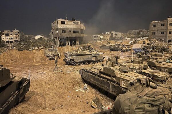 In this undated photo provided by the IDF, Israeli armored personnel carriers are seen during a ground operation in the Gaza Strip.  - Sputnik International