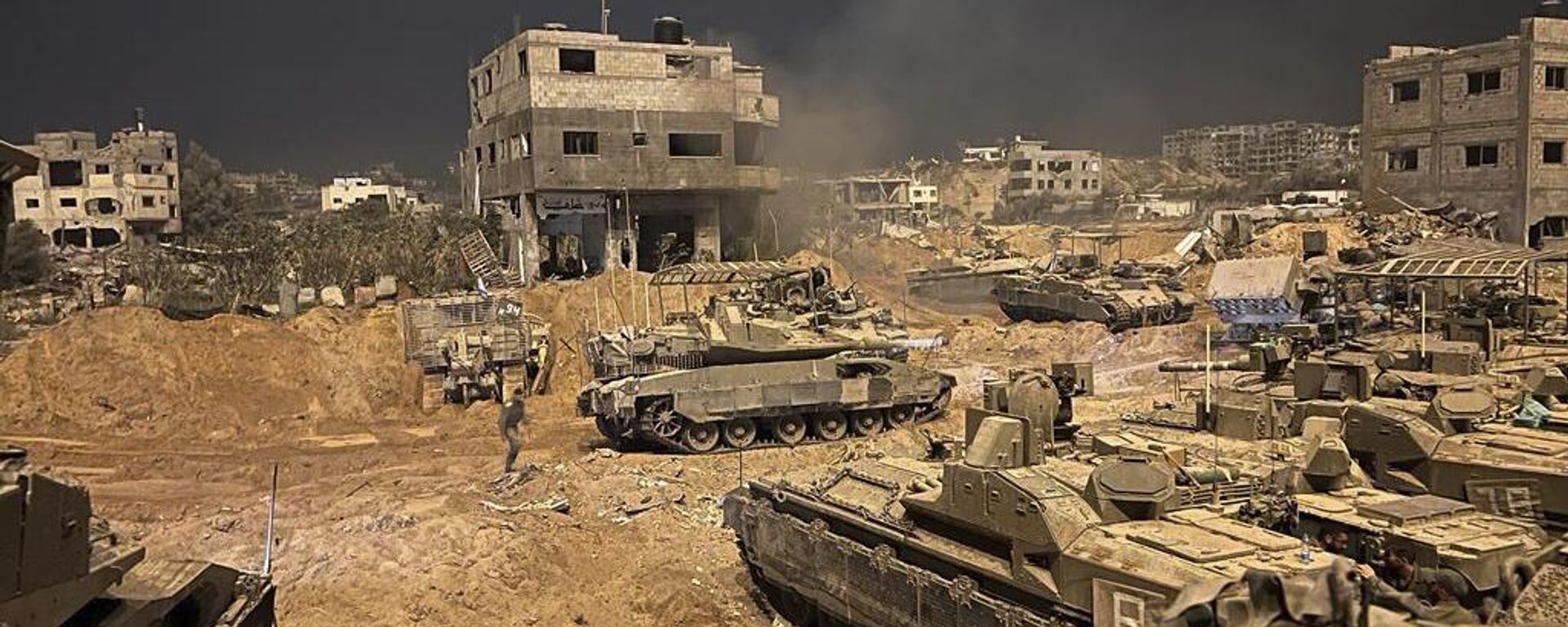 In this undated photo provided by the Israeli military, Israeli armored personnel carriers are seen during a ground operation in the Gaza Strip. Israeli ground forces have been operating in Gaza in recent days as Israel presses ahead with its war against Hamas militants - Sputnik International, 1920, 27.06.2024