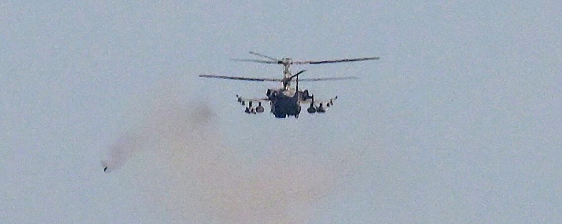 A Russian Ka-52 Alligator attack helicopter fires towards Ukrainian positions in the course of Russia's military operation in Ukraine, at the unknown location. - Sputnik International, 1920, 05.11.2023
