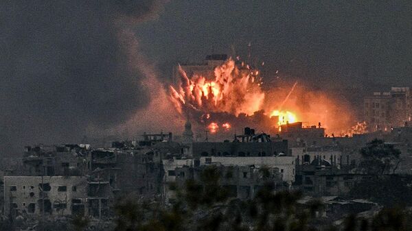 A fireball erupts during Israeli bombardment in the northern Gaza Strip on October 14, 2023. T - Sputnik International