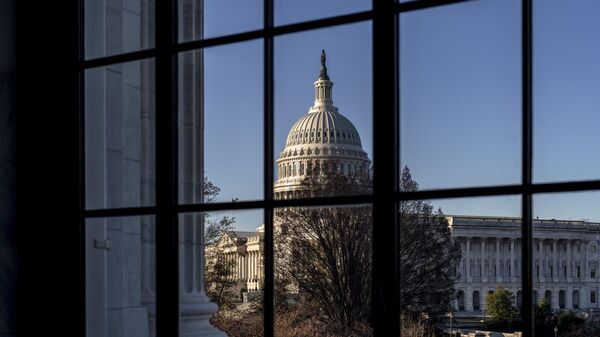 The U.S. Capitol is seen through a window in the Russell Senate Office Building in Washington, March 15, 2023.  - Sputnik International