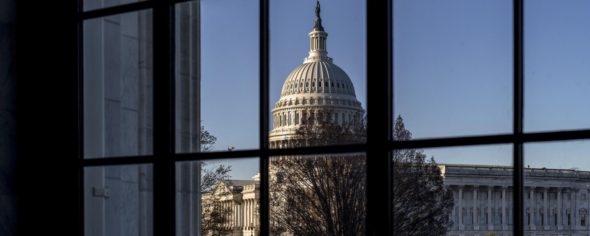 The U.S. Capitol is seen through a window in the Russell Senate Office Building in Washington, March 15, 2023.  - Sputnik International, 1920, 05.12.2023