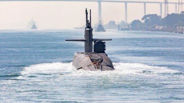 Ohio-class guided-missile sub sailing through the Suez Canal. Note the dry deck jutting out the sub's right side, which denotes its status as a guided-missile sub, rather than the Ohio class's ballistic missile sub variant. - Sputnik International