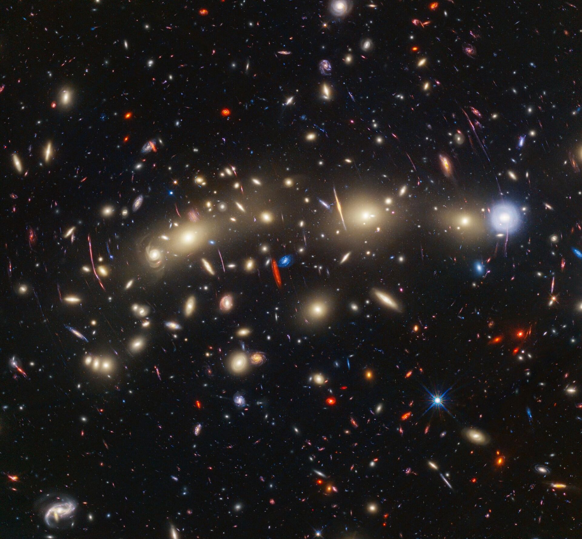 This image of galaxy cluster MACS0416 highlights one particular gravitationally lensed background galaxy, which existed about 3 billion years after the big bang. That galaxy contains a transient, or object that varies in observed brightness over time, that the science team nicknamed “Mothra.” Mothra is a star that is magnified by a factor of at least 4,000 times. The team believes that Mothra is magnified not only by the gravity of galaxy cluster MACS0416, but also by an object known as a “milli-lens” that likely weighs about as much as a globular star cluster. - Sputnik International, 1920, 09.11.2023