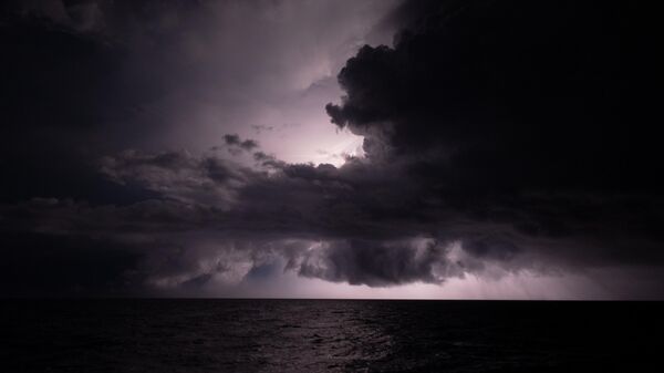 A thunderstorm is seen during a storm in the sea - Sputnik International