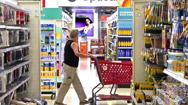 A shopper looks down an aisle in a Target store in Upper Saint Clair, Pa., on Friday, July 7, 2023. - Sputnik International