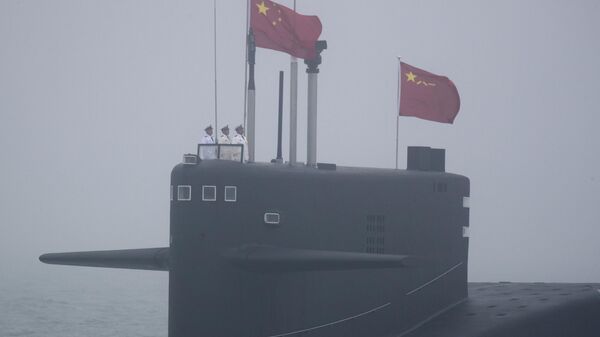 A type 094 Jin-class nuclear submarine Long March 15 of the Chinese People's Liberation Army (PLA) Navy participates in a naval parade to commemorate the 70th anniversary of the founding of China's PLA Navy in the sea near Qingdao, in eastern China's Shandong province on April 23, 2019. - Sputnik International