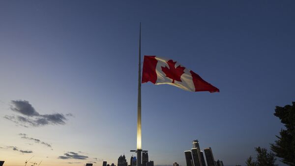 Canadian flag flies on the banks of the Detroit River in Windsor, Ontario, Canada - Sputnik International