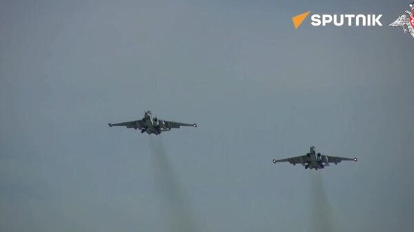 Su-25 attack aircraft of the Russian Air Force destroyed camouflaged field positions and armored vehicles of the Ukrainian Armed Forces.  - Sputnik International