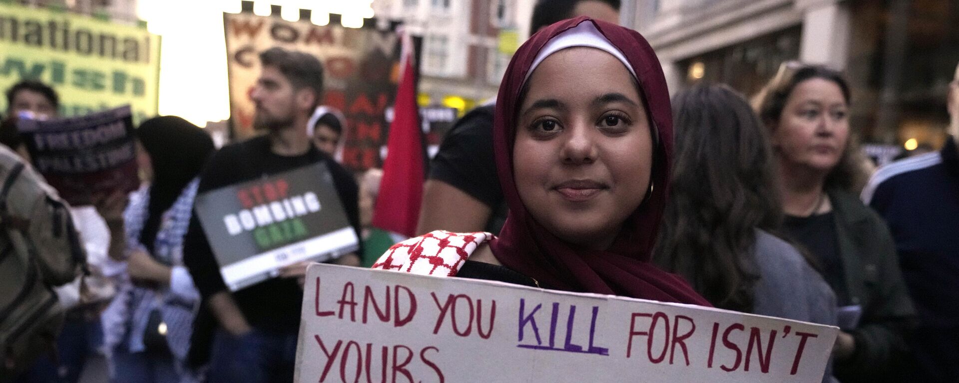 A protester holds a poster during a pro Palestinian demonstration in London, Monday, Oct. 9, 2023 - Sputnik International, 1920, 23.11.2023