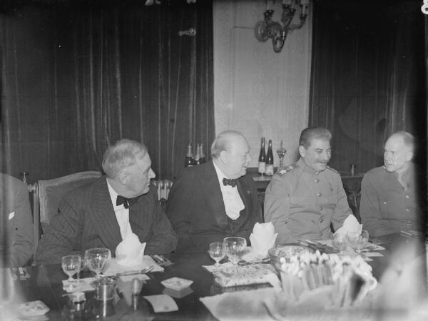 The “Big Three,” Franklin D Roosevelt (US), Winston Churchill (UK), and Joseph Stalin (USSR), sit together at Winston Churchill&#x27;s 69th birthday party, held in the Victorian Drawing Room at the British Embassy in Tehran, Iran (November 30, 1943). - Sputnik International