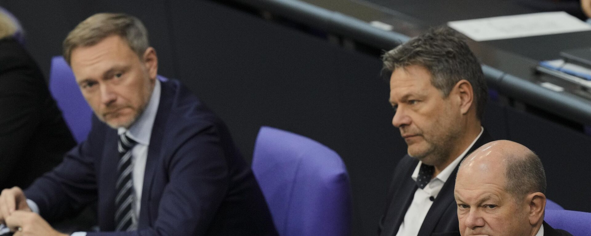 From right, German Chancellor Olaf Scholz, Economy and Climate Minister Robert Habeck and Finance Minister Christian Lindner listen to a debate about Germany's budget crisis at the parliament Bundestag in Berlin, Germany, Tuesday, Nov. 28, 2023. - Sputnik International, 1920, 04.12.2023