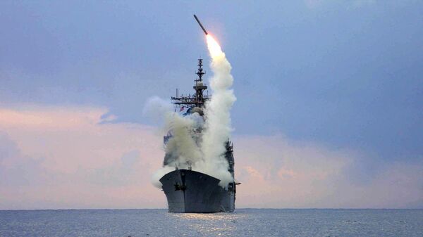 This US Navy handout photo released 23 March 2003 shows a US Navy Tomahawk Land Attack Missile (TLAM) being launched from the guided missile cruiser USS Cape St. George, 23 March 2003, in the Mediterranean Sea. - Sputnik International