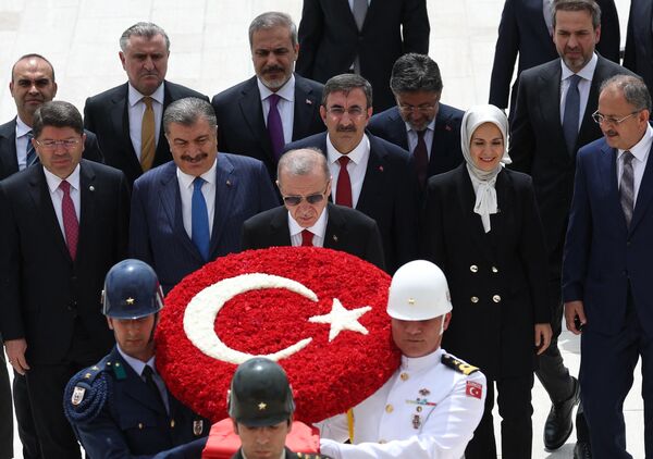 In a high stakes Turkish presidential election, President Recep Tayyip Erdogan won a historic runoff election and took office for a third time in a row. (Turkish President Recep Tayyip Erdogan (center) and members of his new cabinet walk with servicemen carrying a wreath as they visit Anitkabir, the mausoleum of Turkish Republic&#x27;s founder Mustafa Kemal Ataturk, before their first cabinet meeting in Ankara, on June 6, 2023). - Sputnik International