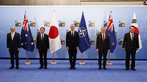 (L-R) Australia's Prime Minister Anthony Albanese, Japan's Prime Minister Fumio Kishida, NATO Secretary General Jens Stoltenberg, New Zealand's Prime Minister Chris Hipkins and South Korea's President Yoon Suk-yeol pose for a family photo prior to a meeting of the North Atlantic Council (NAC) with Asia Pacific partners during the NATO Summit in Vilnius, Lithuania, on July 12, 2023.  - Sputnik International