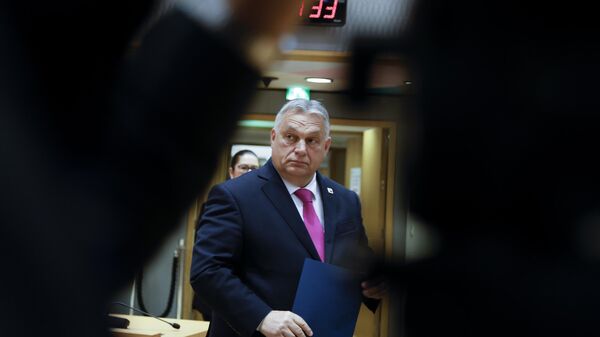 Hungary's Prime Minister Viktor Orban arrives for a round table meeting at an EU summit in Brussels, Thursday, Dec. 14, 2023.  - Sputnik International