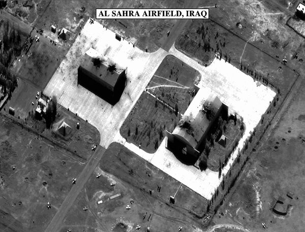 This photo, released December 18 by the US Department of Defense and used in a Pentagon briefing, shows bomb damage to two hangars at the Al Sahra Airfield in Iraq. - Sputnik International