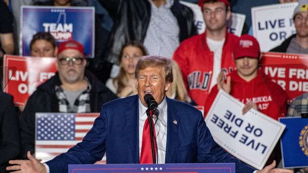 Former US President and 2024 Republican presidential hopeful Donald Trump speaks during a campaign rally at the University of New Hampshire's Whittemore Center Arena in Durham, New Hampshire, on December 16, 2023 - Sputnik International