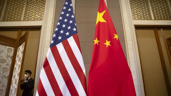 US and Chinese flags are seen before a meeting between US Treasury Secretary Janet Yellen and Chinese Vice Premier He Lifeng at the Diaoyutai State Guesthouse in Beijing on July 8, 2023 - Sputnik International