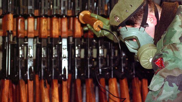 Bosnian Serb Army soldier measures levels of radiation on weapons and army equipment at a military factory in eastern Bosnian town of Bratunac, 40 miles (65 kms)  southeast of Tuzla, Bosnia-Herzegovina Wednesday, Jan. 17, 2001.  - Sputnik International