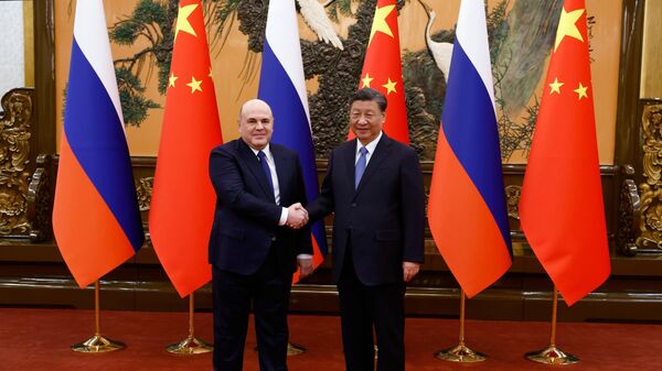 Russian PM Mikhail Mishustin and Chinese President Xi Jinping, December 20, 2023 - Sputnik International