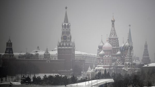 Spasskaya Tower and St. Basil's Cathedral are pictured on a foggy winter day, in downtown Moscow, Russia. - Sputnik International