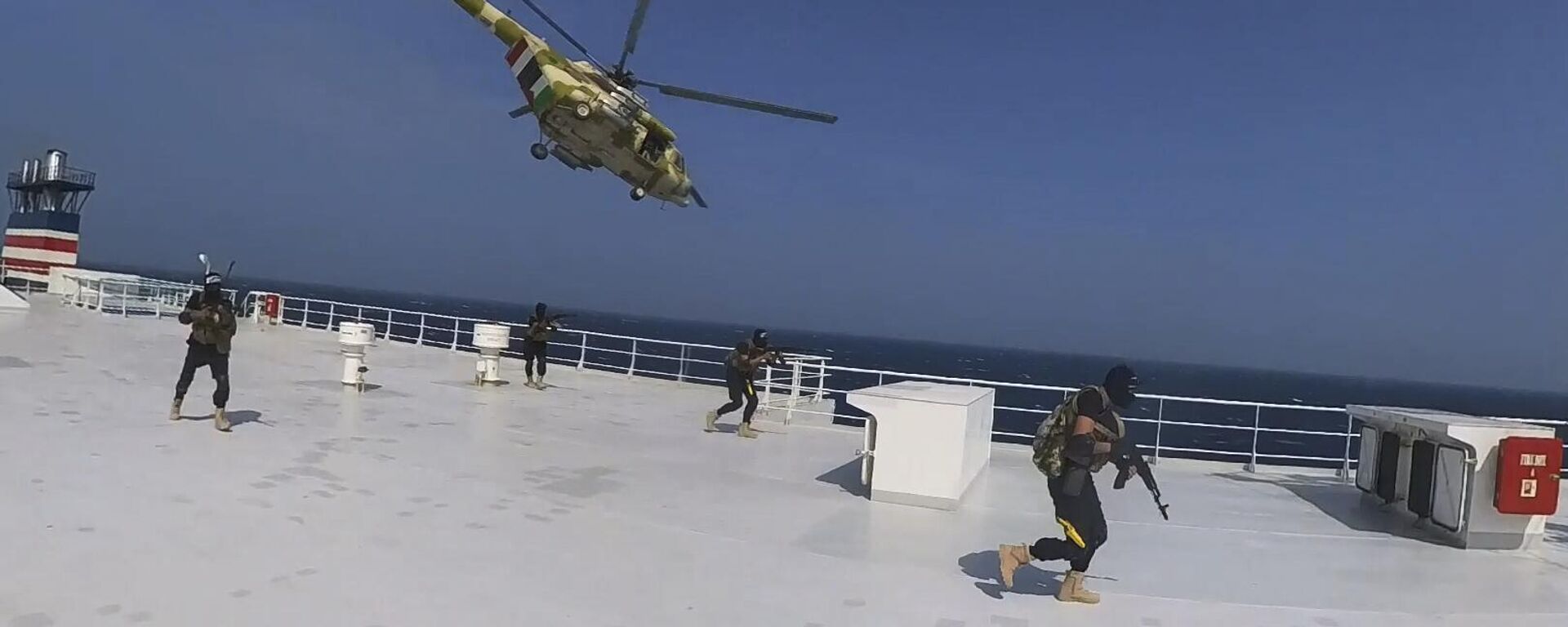 This photo released by the Houthi Media Center shows Houthi forces boarding the cargo ship Galaxy Leader on Sunday, Nov. 19, 2023. Yemen's Houthis have seized the ship in the Red Sea off the coast of Yemen after threatening to seize all vessels owned by Israeli companies.  - Sputnik International, 1920, 04.01.2024