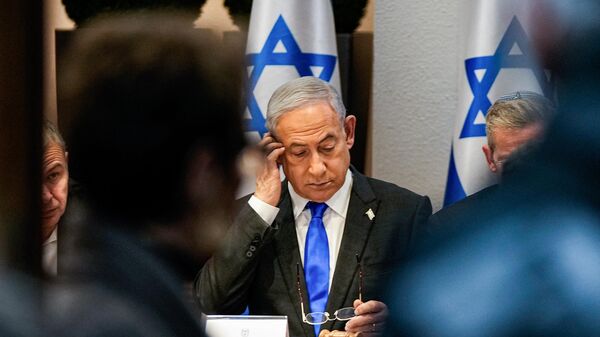Israel's Prime Minister Benjamin Netanyahu chairs a cabinet meeting at the Kirya military base, which houses the Israeli Ministry of Defence, in Tel Aviv on December 24, 2023.  - Sputnik International