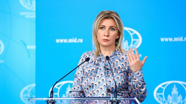 In this handout photo released by the Russian Foreign Ministry, Russian Foreign Ministry’s spokeswoman Maria Zakharova attends her weekly briefing in Moscow, Russia - Sputnik International
