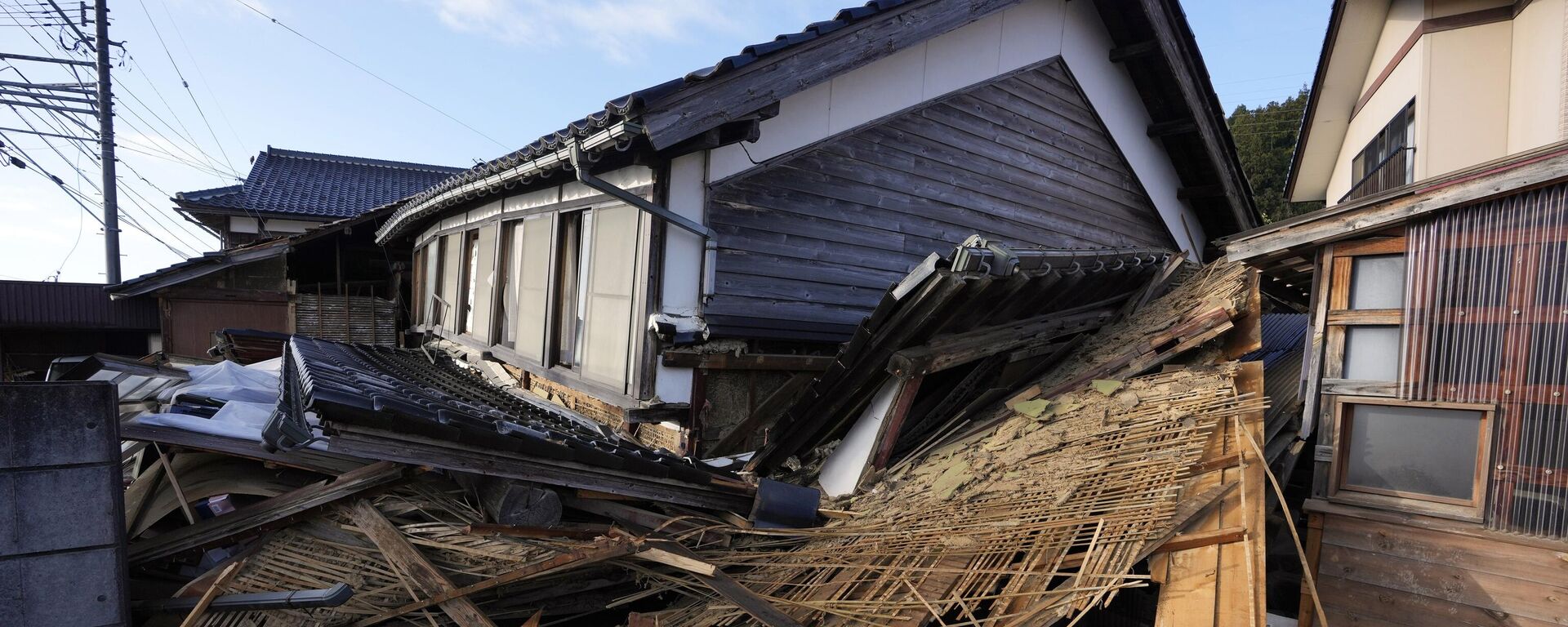 A two-story house with its first floor collapsed caused by powerful earthquake is seen Tuesday, Jan. 2, 2024, near Nanao, Ishikawa Prefecture, Japan. - Sputnik International, 1920, 08.01.2024